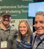 Josh Rubin and Alana Elsey posing for a photo with Andy Plax at EMS 2025.